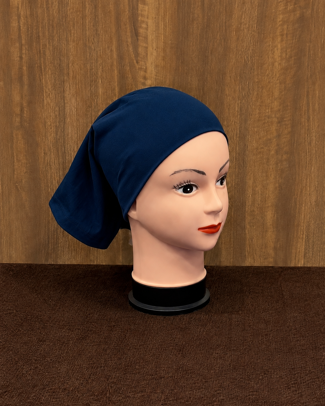 Close up of navy blue tube cap worn on mannequin