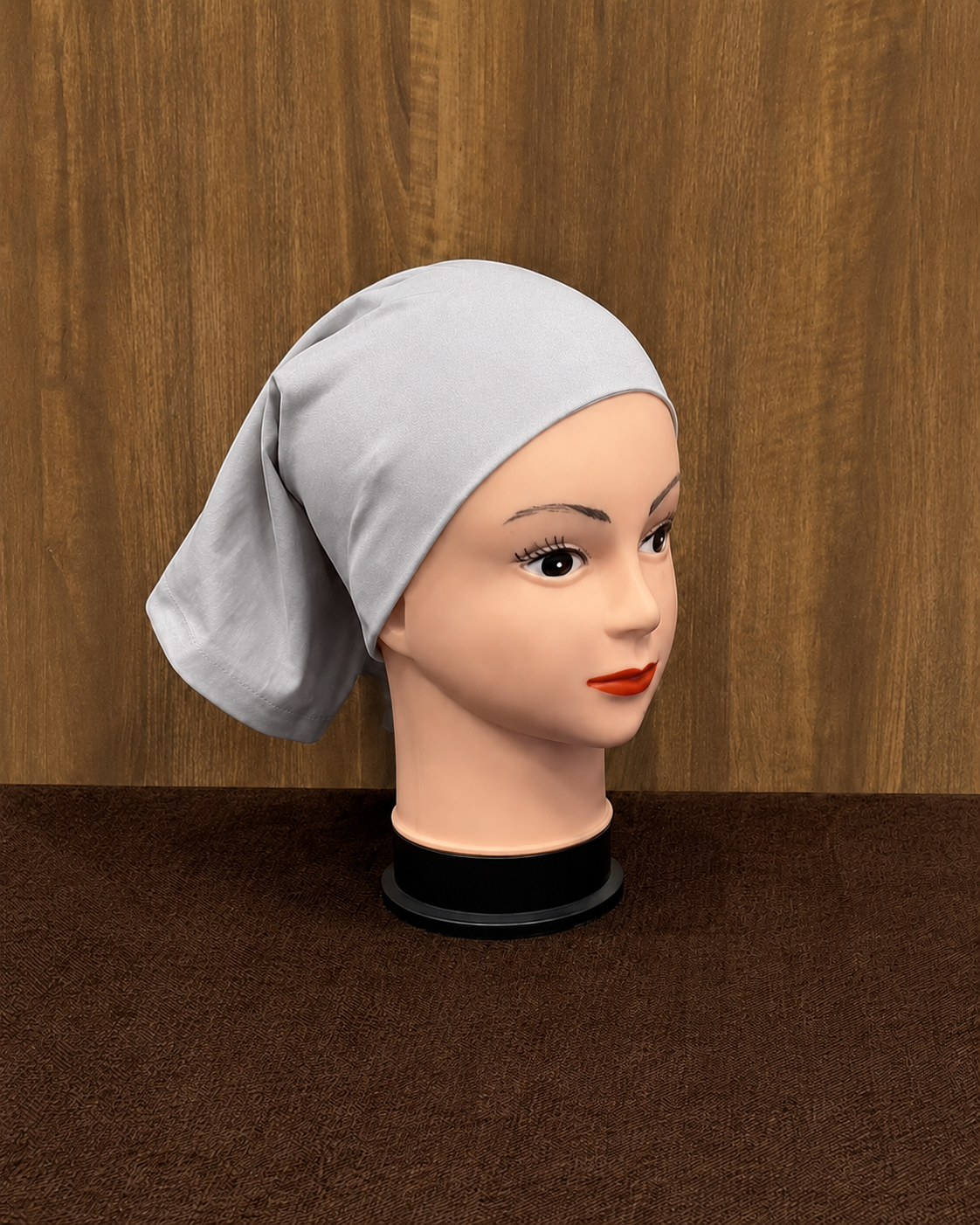 Silver hijab tube cap showcased on mannequin