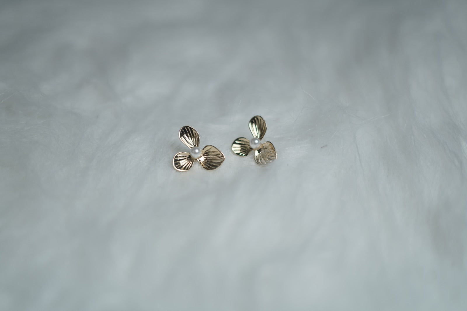 Vintage Petal Stud Earrings on white background.