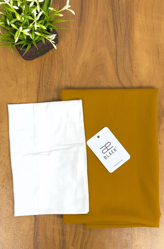 Bold mustard hijab with a crisp white cap for a fresh, modern look.