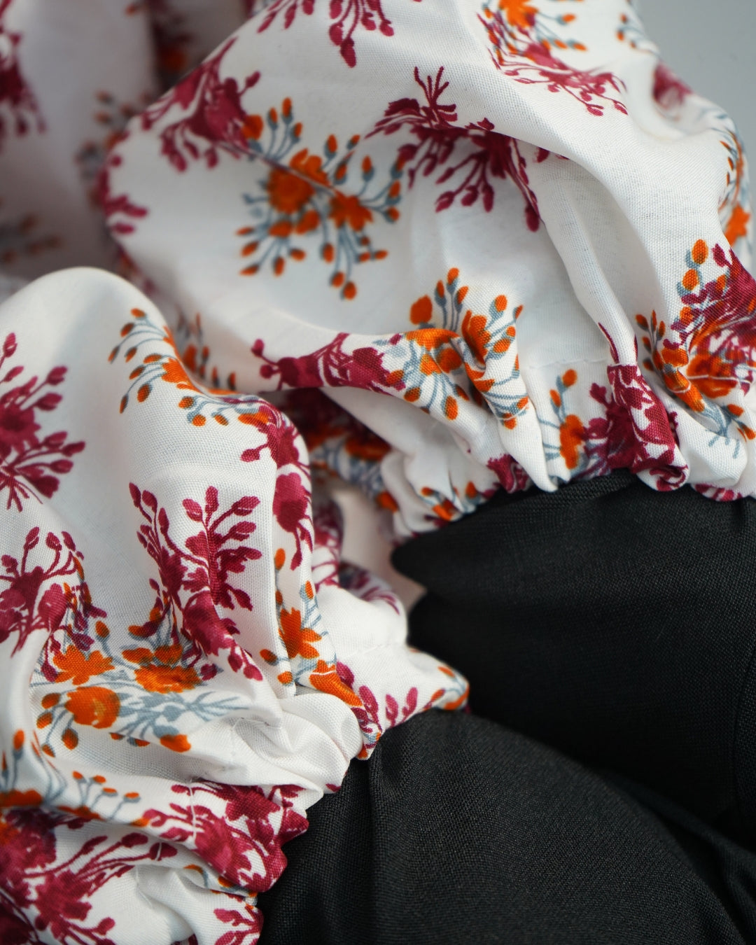 Elasticated sleeve of white floral prayer dress.