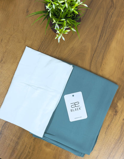 Stylish mint green hijab with a white cap for effortless wear.