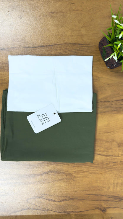 White hijab cap paired with olive-colored hijab, both folded.
