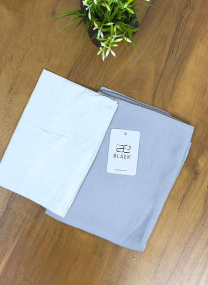 Silky silver hijab with a bright white cap for a sleek contrast.