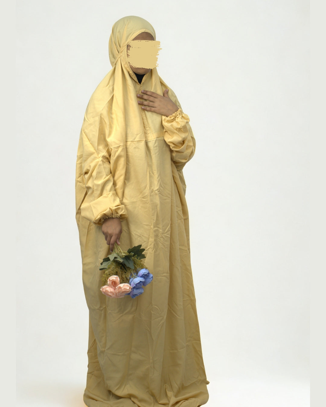 Woman wearing yellow polyester lycra prayer dress full body view.