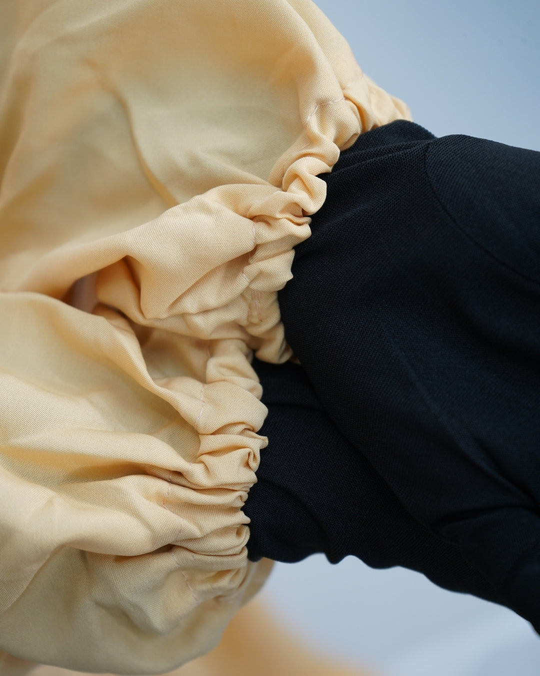 Elasticated sleeve design of yellow prayer dress.